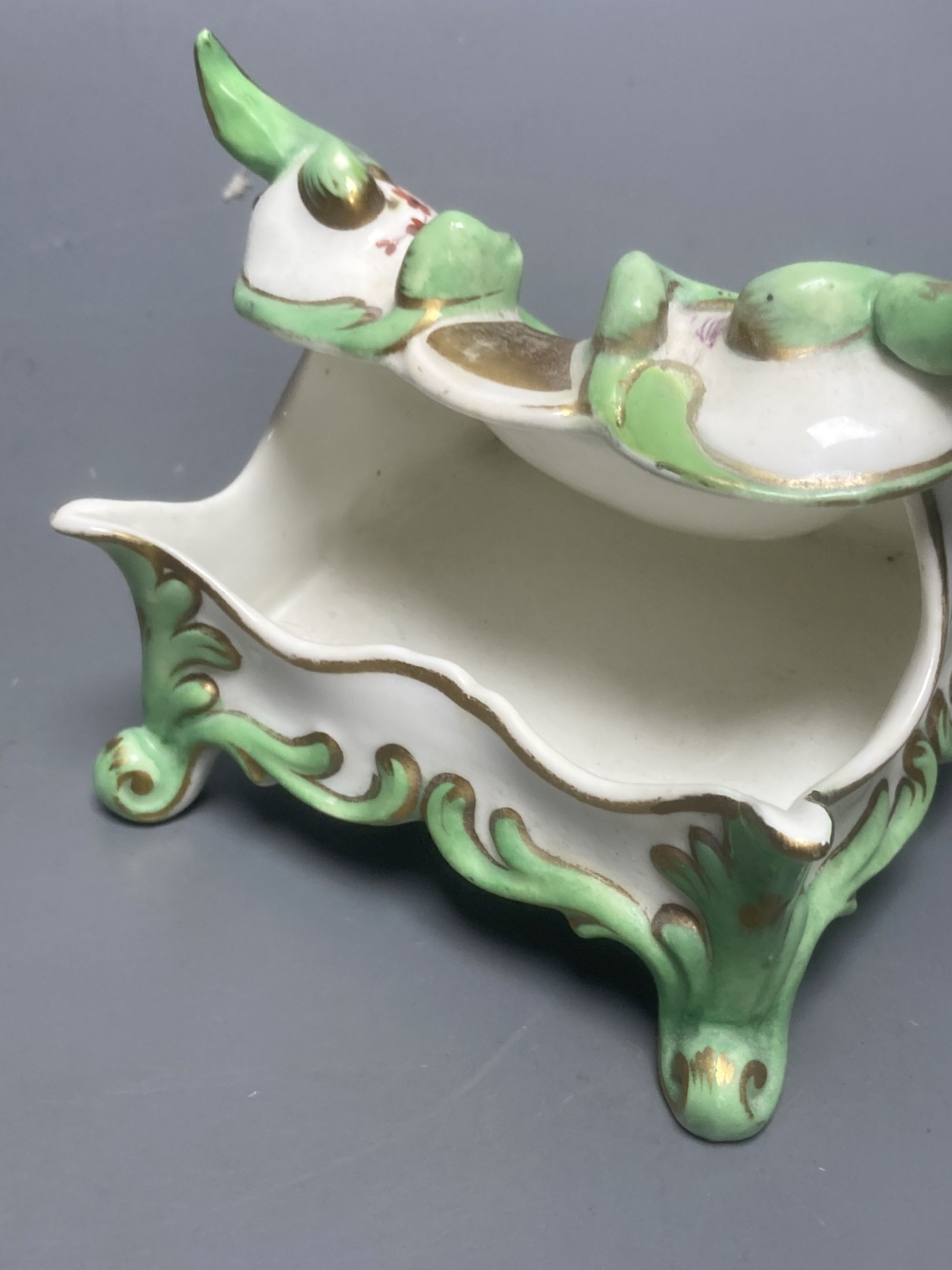 An English porcelain watch stand, probably Ridgway c.1830 and a Coalport style 'Turk's head' chamberstick (lacking handle)